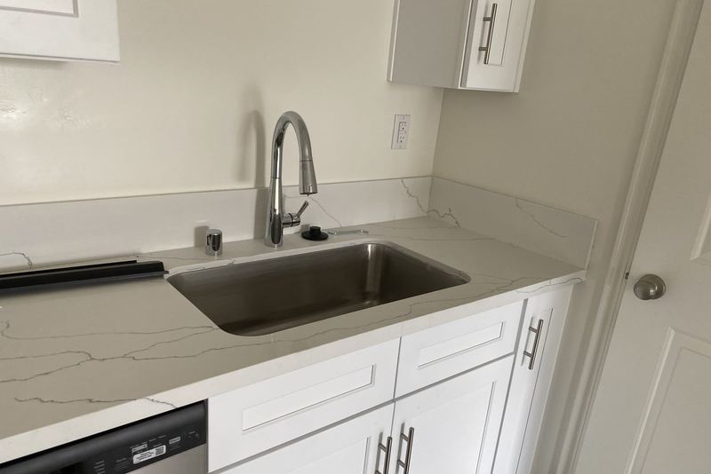 Finished kitchen with a stainless undermount sink and new pull-down faucet