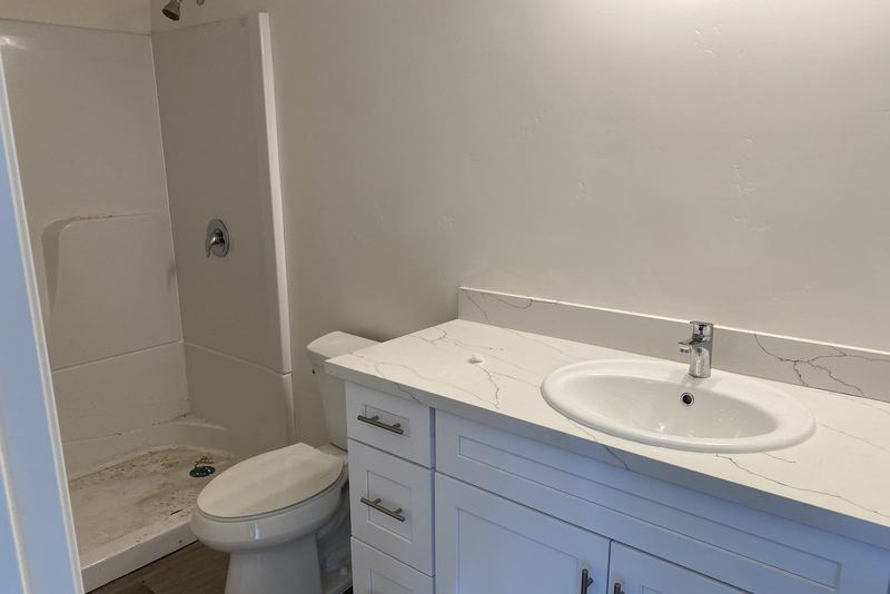 Finished bathroom with a new vanity, sink and toilet installed