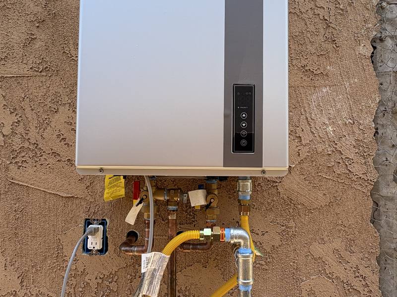 High-efficiency wall-mounted water heater with a copper manifold and new gas connection