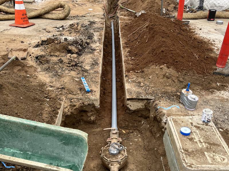 New water service line and meter box set in an open trench